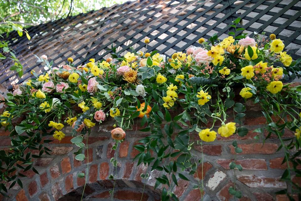 Courtyard ceremony florals