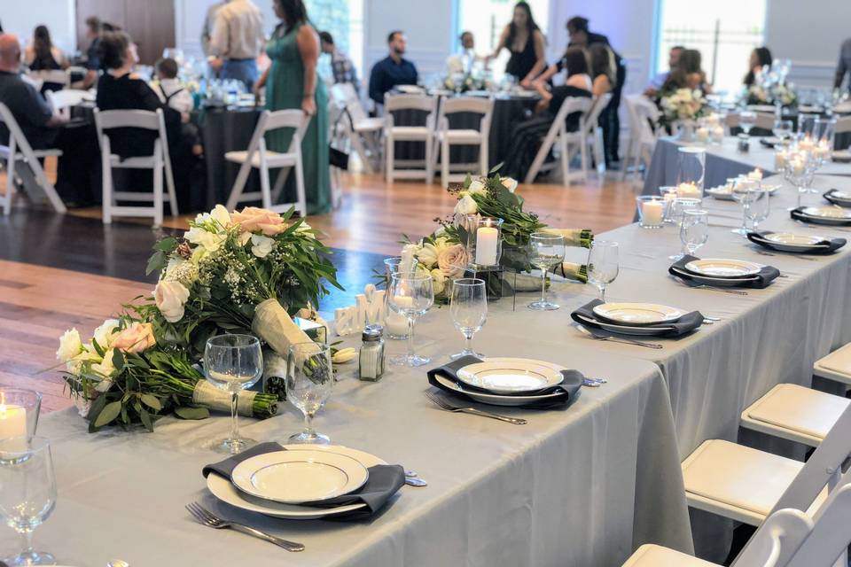 Using bridal and bridesmaids bouquets on the head table is a great way to display these beautiful flowers.