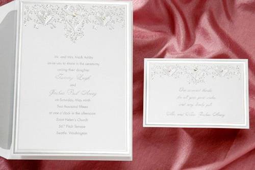 The classic silver foil stamping on this invitation is exquisite! The center elements are embossed to look like rhinestones.