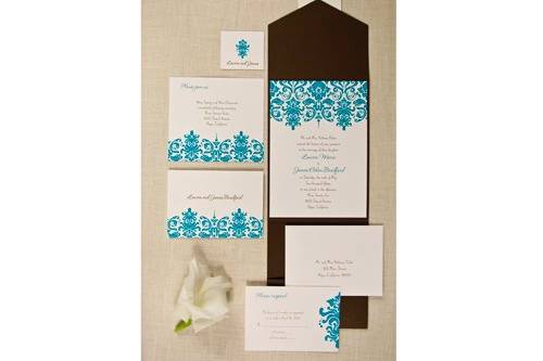 Your wording is flat printed in mocha while your names match the damask pattern in aqua on luxurious bright white paper. Personalized tabs and mocha pockets are included.