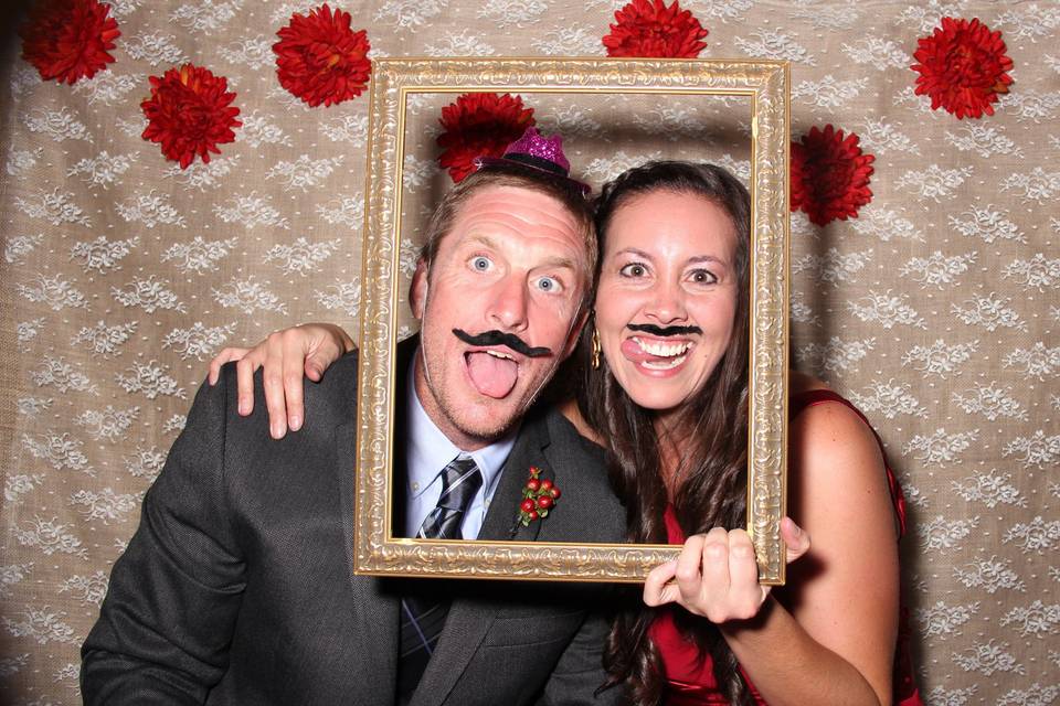 Couple photo using a mustache prop