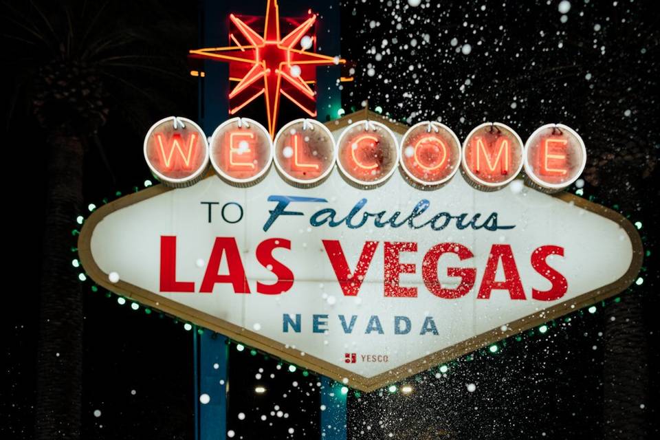 Popping champagne at sign