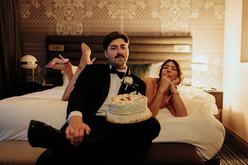Couple with cake in hotel
