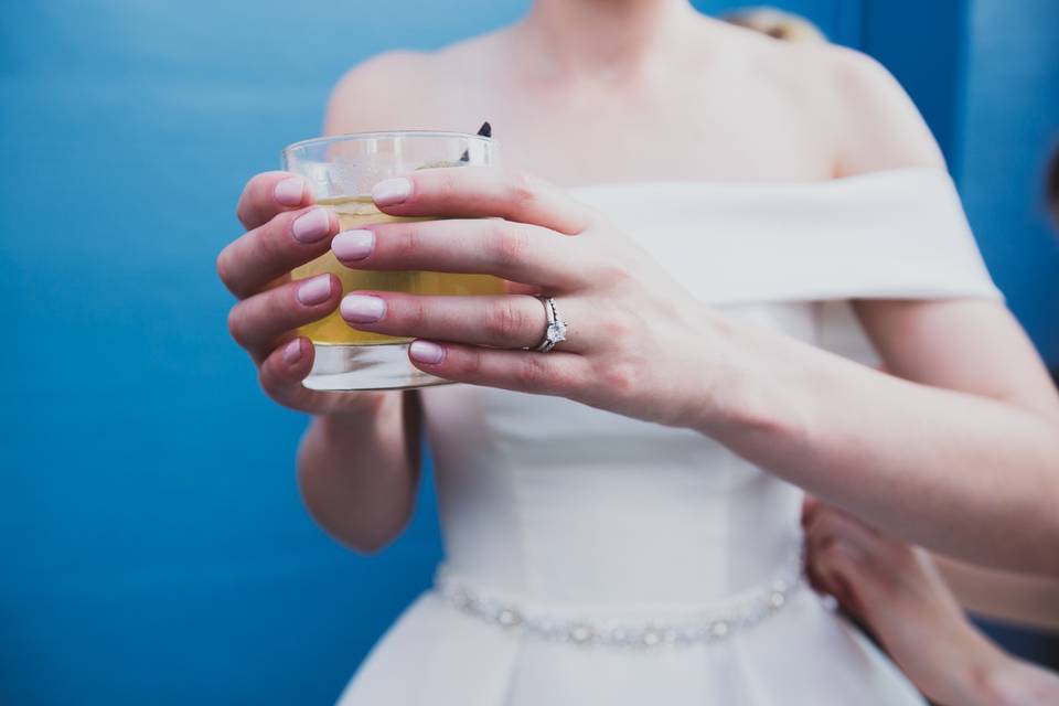 Bride holding drink