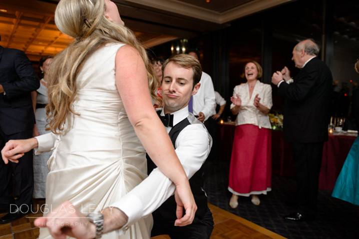 Newlyweds dancing with each other