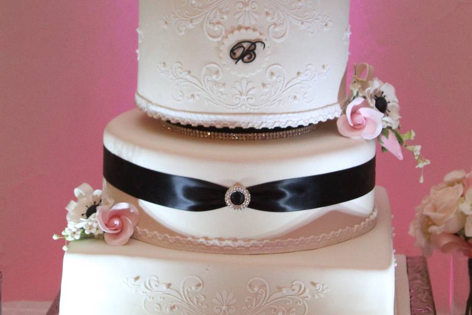 Wedding cake with black ribbons