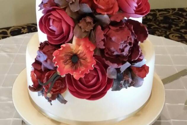 Cascading flowers on cake
