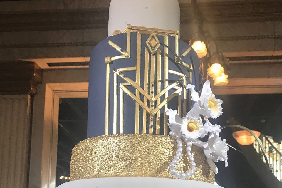 Wedding cake with black and gold tiers
