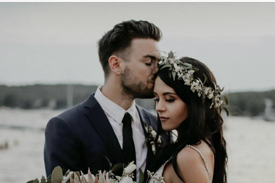 Groom kissing his bride