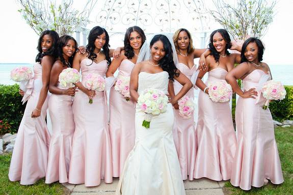 Bridesmaids behind their bride