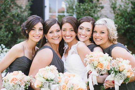 Bride with her bridesmaids in grey