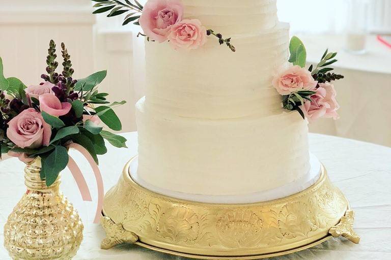 Wedding cake adorned with roses