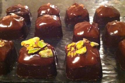 dark chocolate caramel dipped in milk chocolate garnished with pink himalayan salt