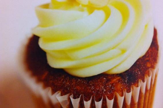 Salted Chocolate Cupcake with mango passion fruit icing and sugared flower