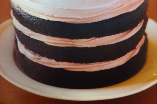 Layered Chocolate Cake with flower garnish
