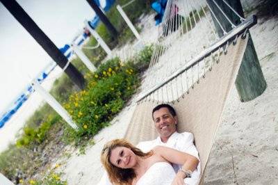 Beach wedding, bride and groom in hammock