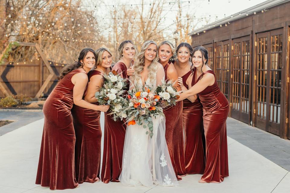 Bridesmaids behind the barn