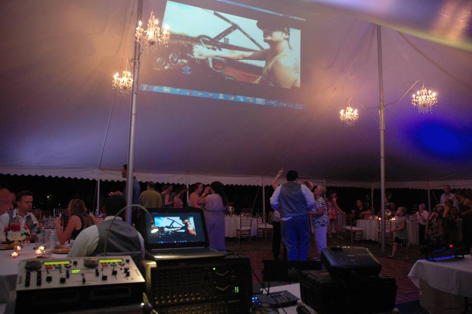 Music videos projected on the roof of slanted tent. Customized Gobo Monograms also available.
