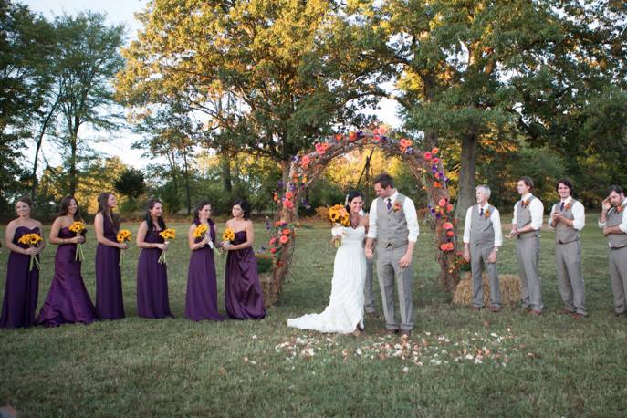 The couple with the bridesmaids and groomsmen