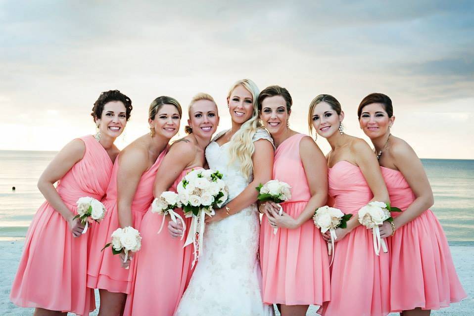 Bride and her bridesmaids at the beach