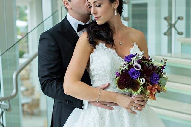 Groom embracing his bride