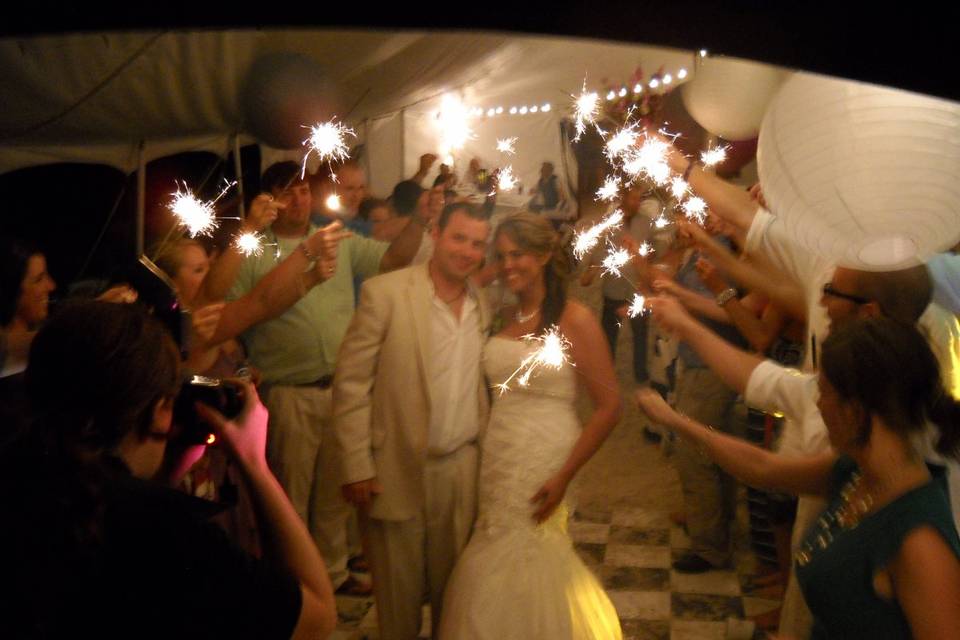 Sparkler exit beach wedding under the tent