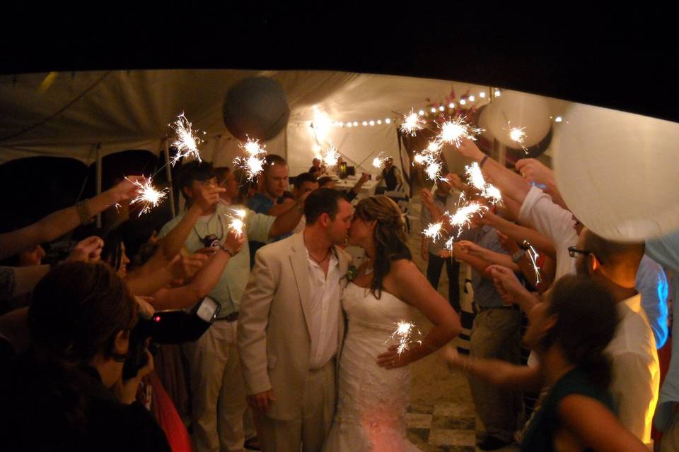 Leaving the beach wedding through sparklers