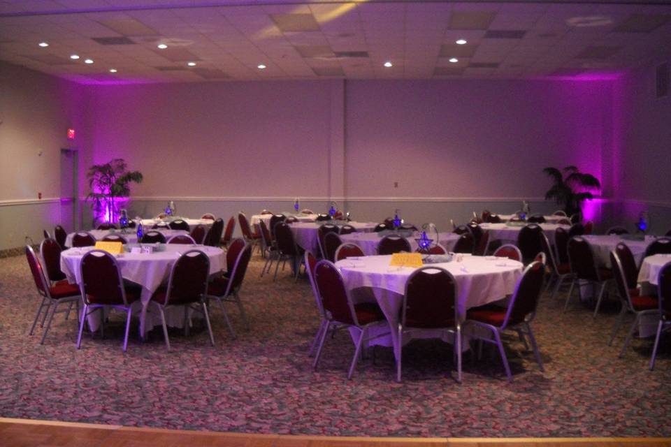 Head table with uplighting at navarre conference center