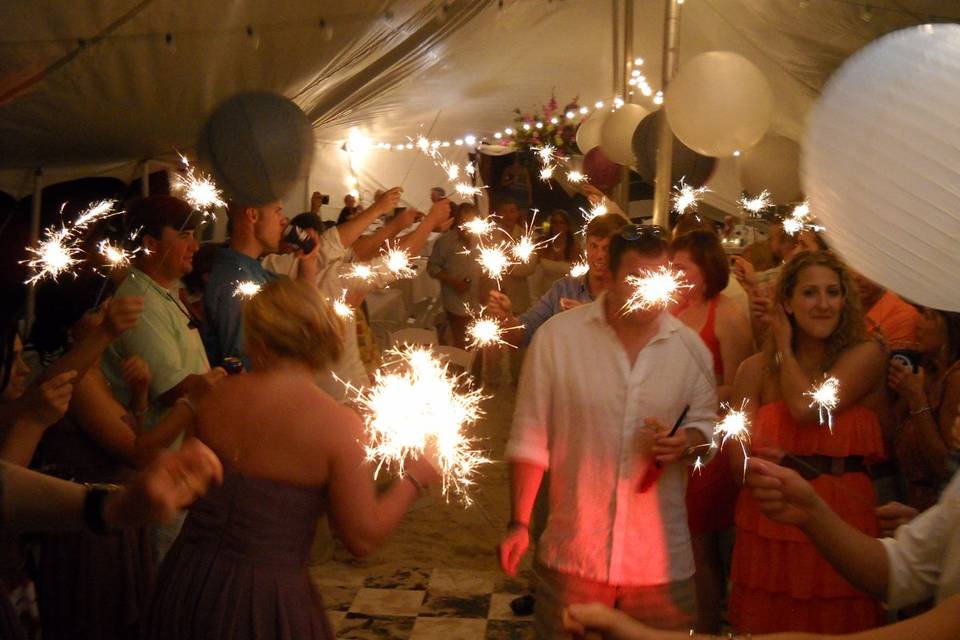 Sparkler exit beach wedding under the tent