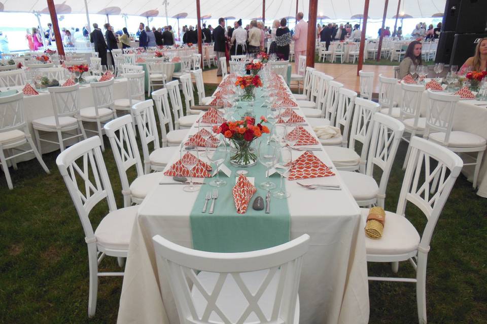 Orange and teal make for a fanciful but elegant beach-inspired reception in Maine.