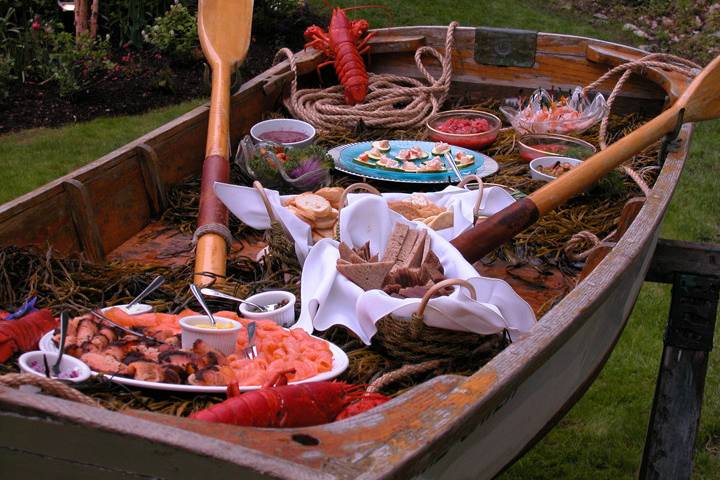 A rustic rowboat is the perfect serving piece for our raw bar and seafood selection.