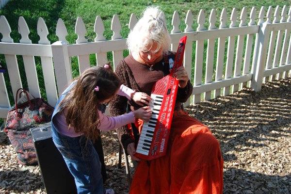 Nancy playing her Keytar at a Montessori School function