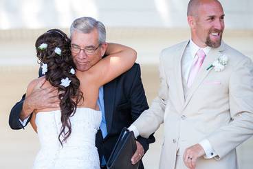 Couple with the officiant