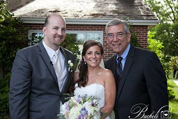 The newlyweds and the officiant