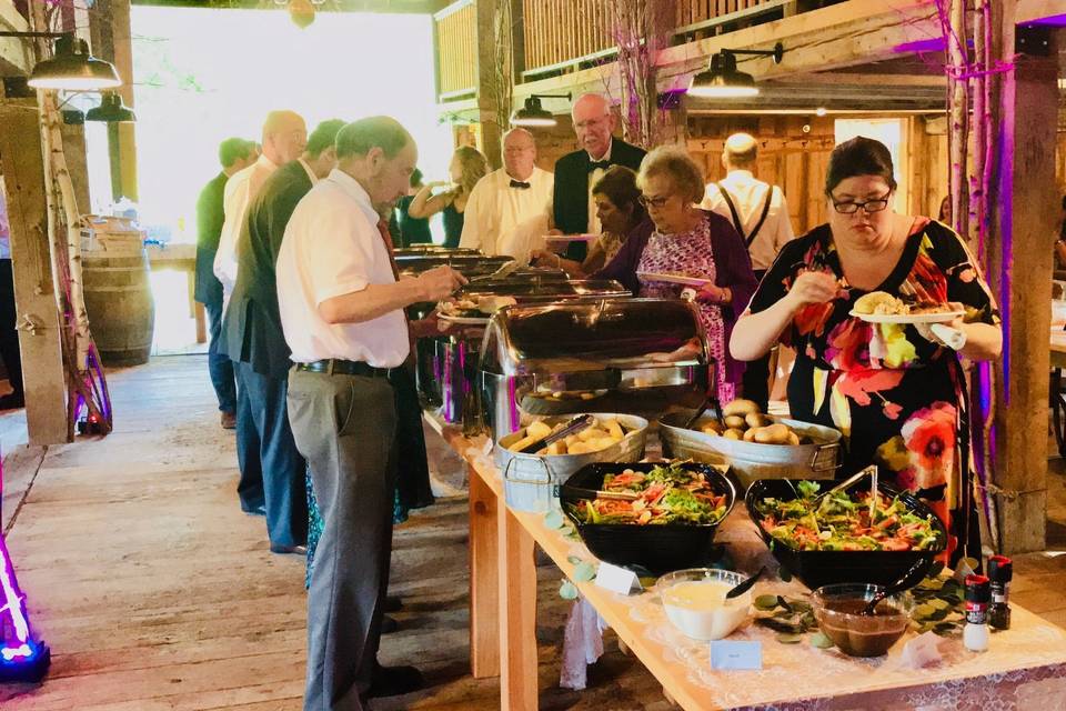 Guests serving themselves at the buffet line