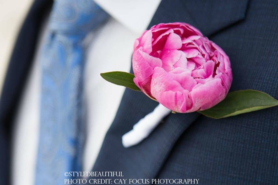 Blooming peony boutonniere