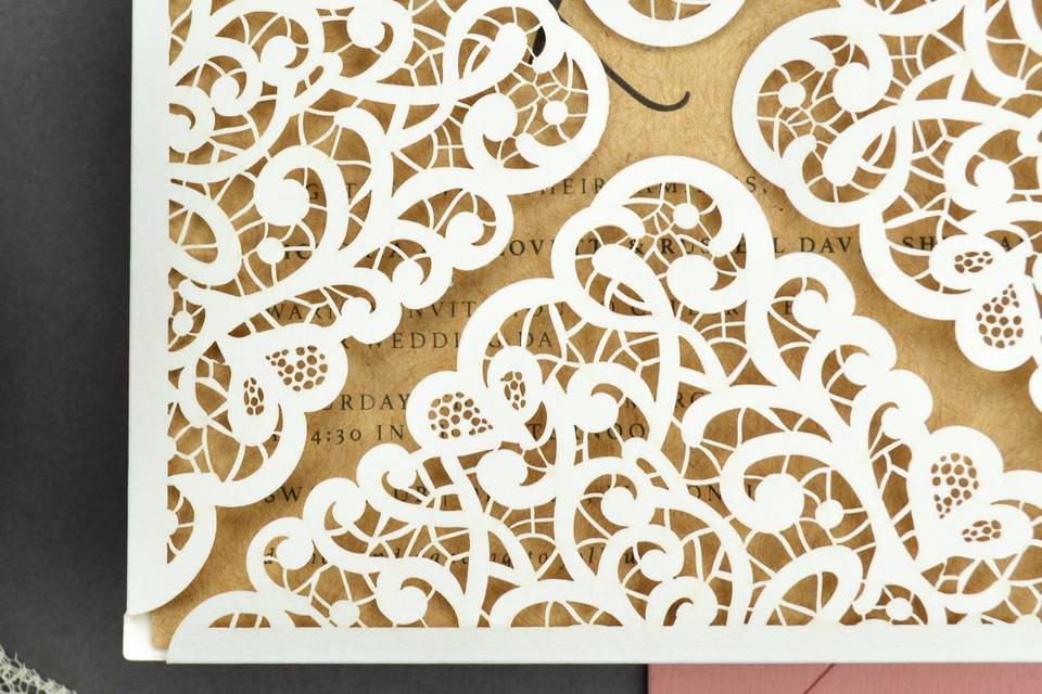 Lace laser cut petal fold for rustic, romantic wedding invitations. Shown in Snow White with Straw Kraft invitation and Dusty Rose envelope.