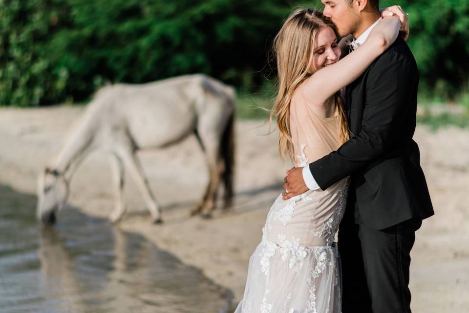 Couple with horse on the beach
