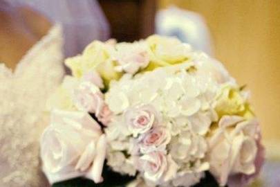 Big round beautiful bouquet very pale colors are nice and not distracting from the bride