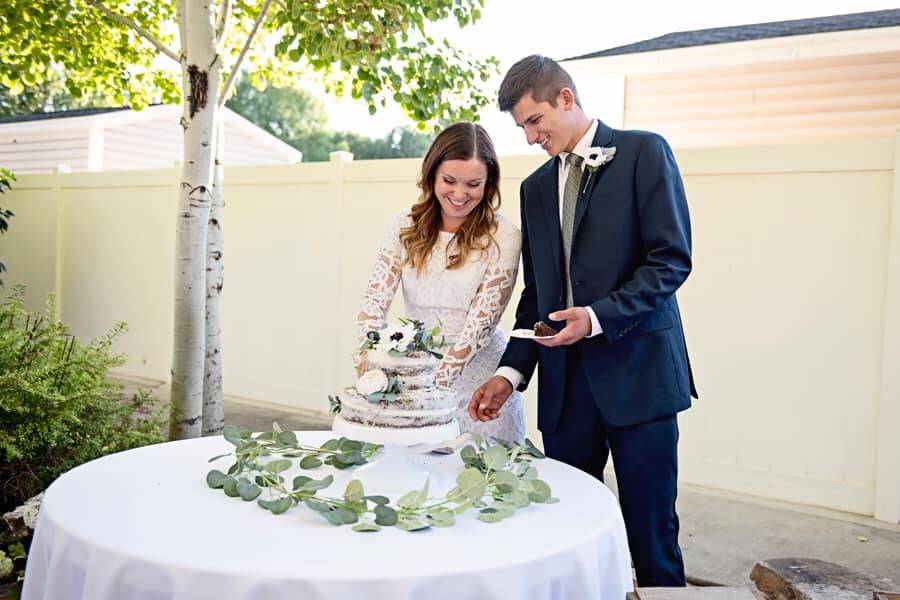 Couple cutting cake