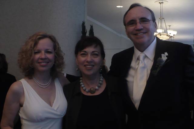 Couple with the officiant