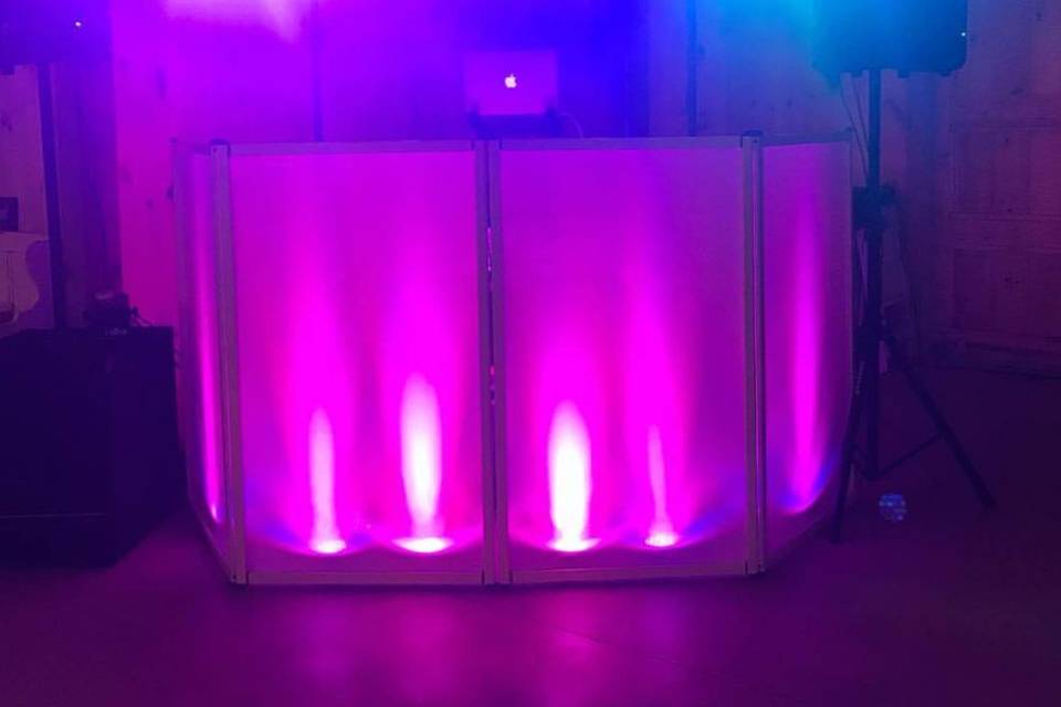 DJ booth with uplighting