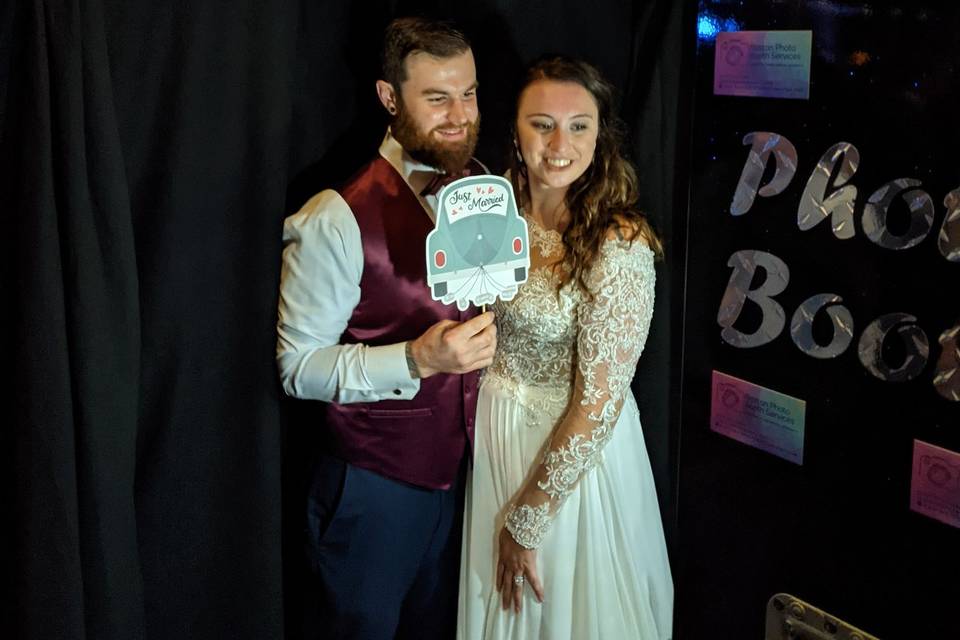 Bride and Groom In Photo Booth