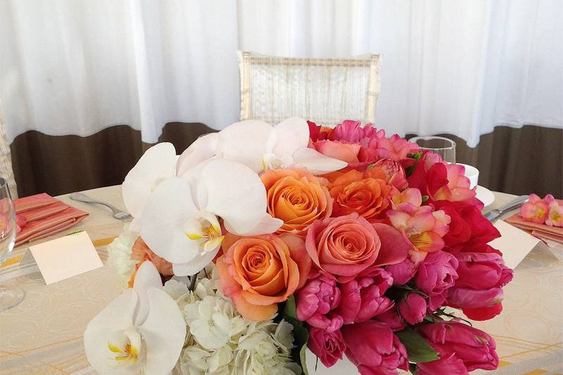 Pinks, corals, oranges & white reception centerpieces