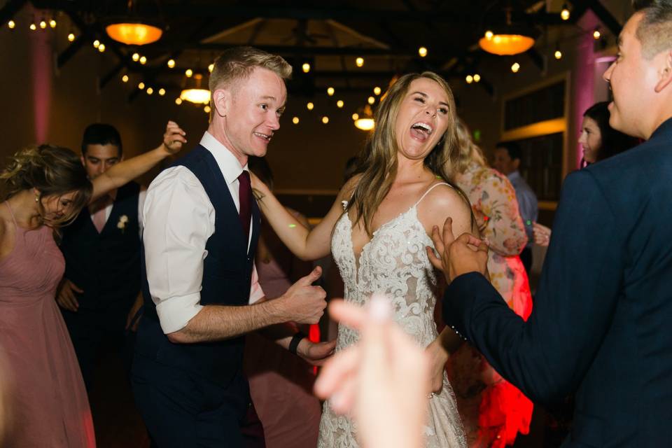 Newlyweds and guests on the dance floor