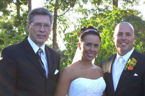 Newlyweds with the officiant