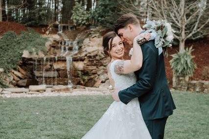 Wedding couple by waterfall