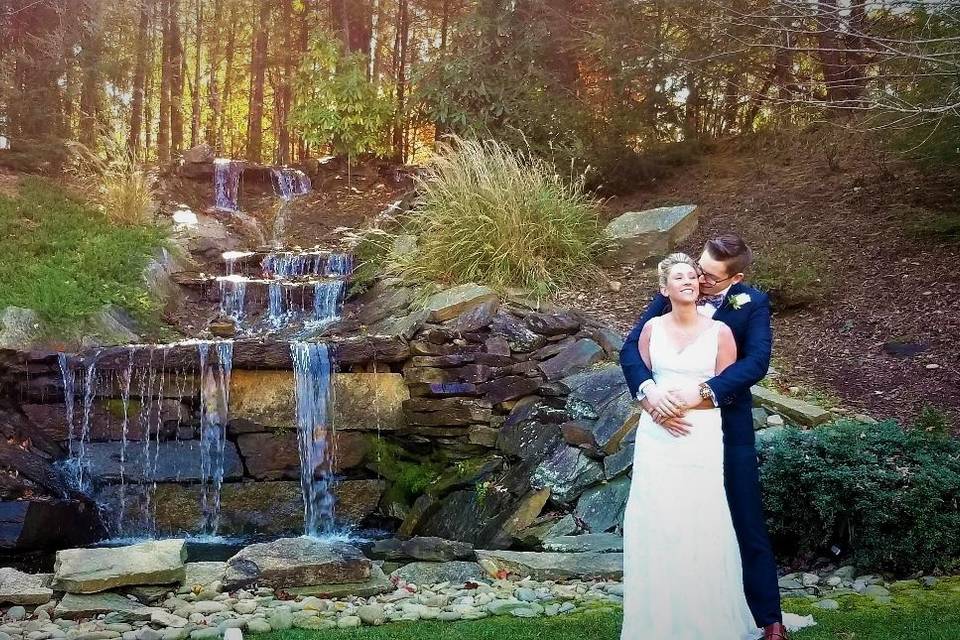 Wedding couple by waterfall