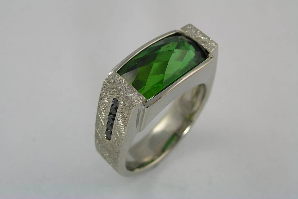 14 karat white gold gents wedding ring set with Stephen Avery diamond back cut green tourmaline with diamonds