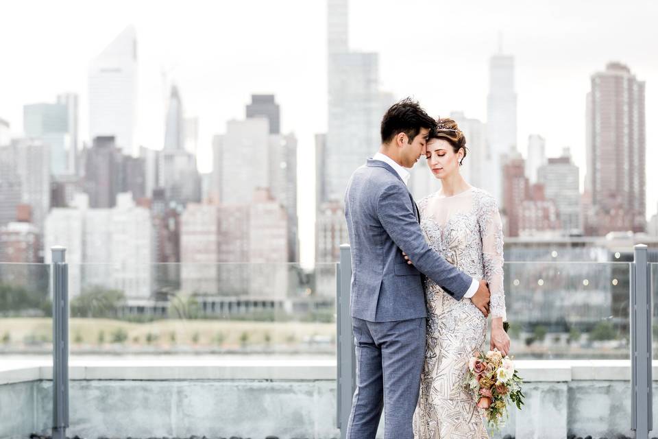 Newlyweds with the skyline in the backdrop